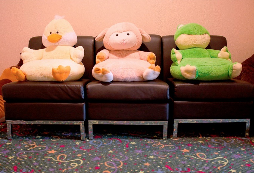 Stuffed animal toys on waiting room chairs