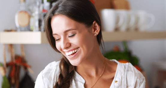 Woman with flawless smile thanks to dental care