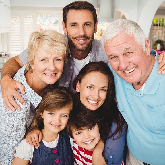 Three generations of family smiling together