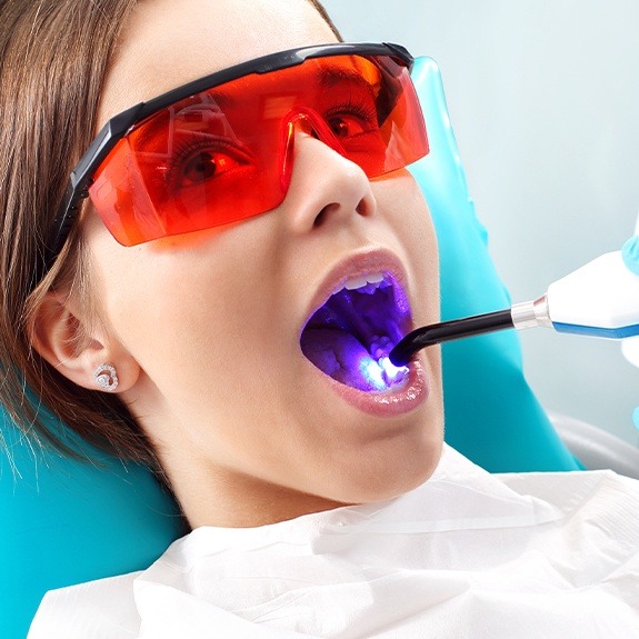 Young girl receiving dental sealants