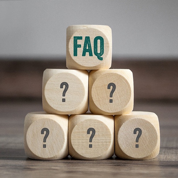 FAQ wooden blocks stacked in a pyramid 