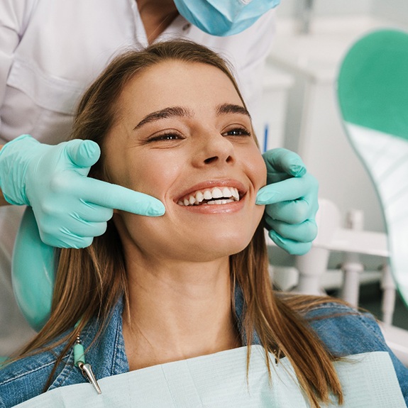 Woman smiling in the dental chair