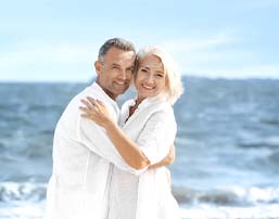 Couple smiling with dental implants in Royse City