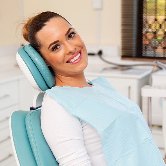 Woman in dental chair after dental checkup
