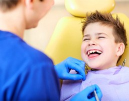 Boy laughing while using oral conscious sedation for kids in Royse City 