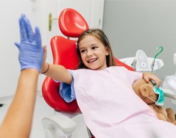 girl high-fiving pediatric sedation dentistry in Royse City  