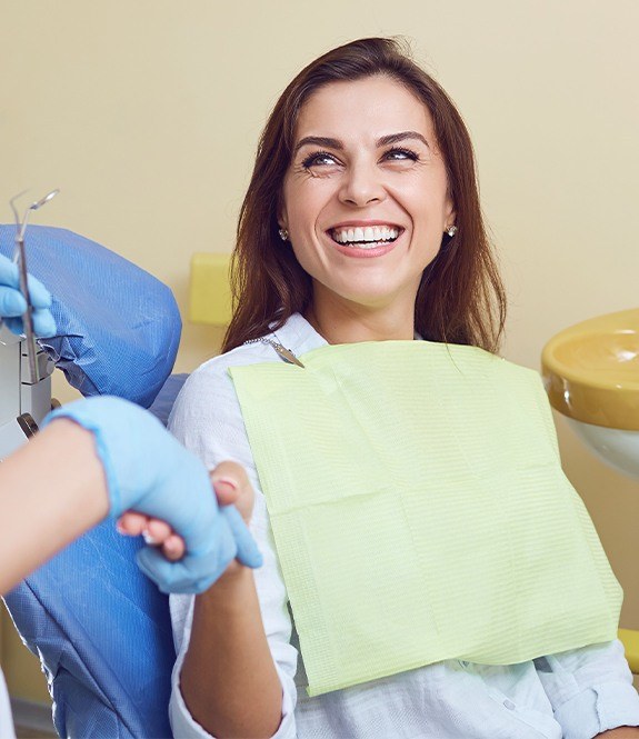 Woman smiling during preventive dentistry appointment