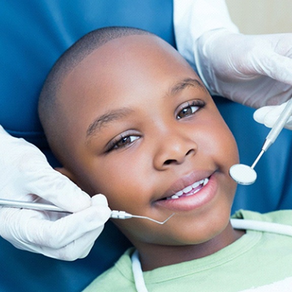 little boy smiling at his dental checkup 