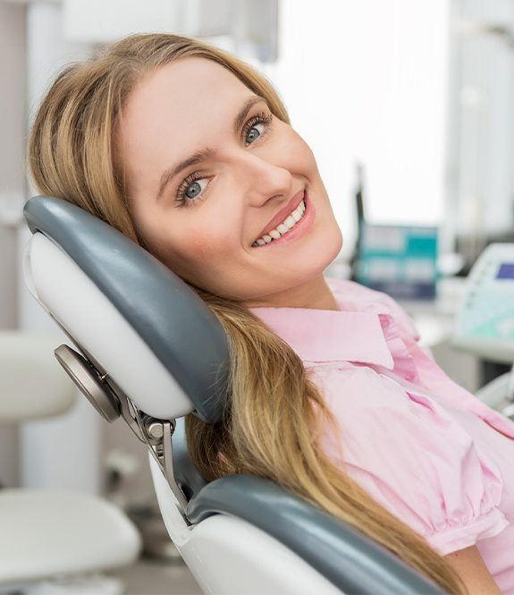 Woman relaxed at dental office thanks to sedation dentistry