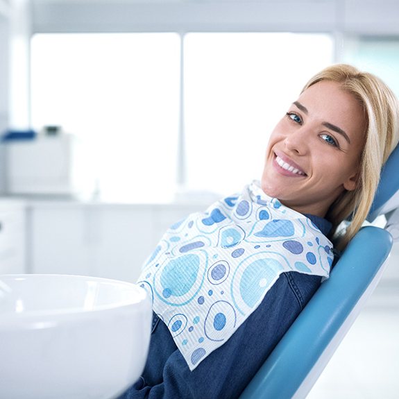 Smiling woman sitting in dental office