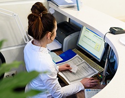 Receptionist at a desk