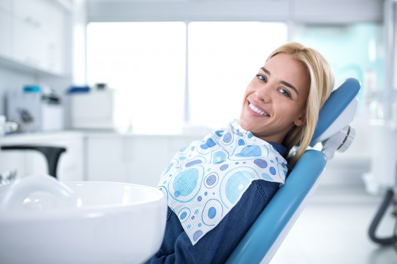 A woman visiting a community dentist in Royse City.