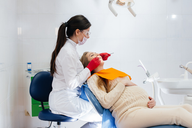 patient smiling while visiting dentist