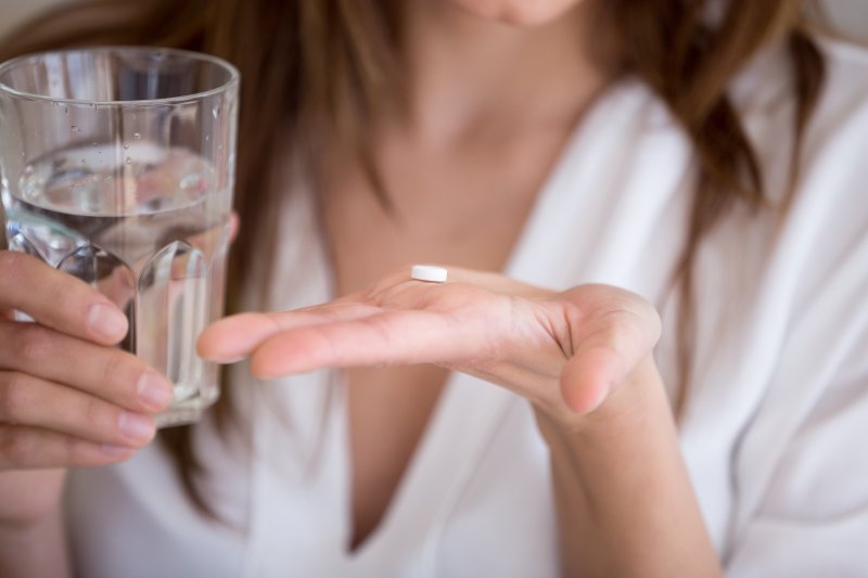 Lady prepares to take pill